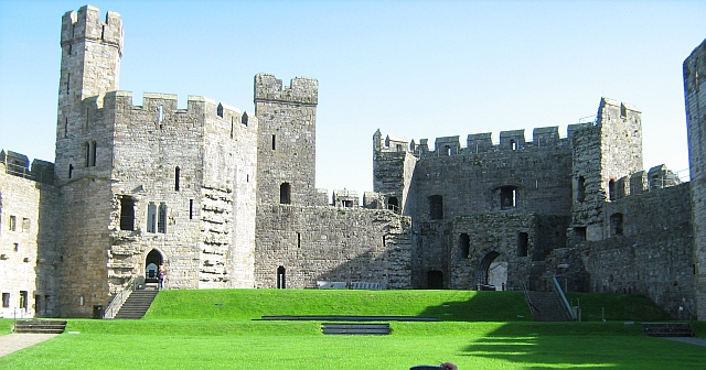 caernarfon castle from within the walls - towers, castellations and big stone built walls